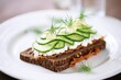 rye bread with cottage cheese and sliced cucumber