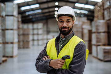 Wall Mural - Warehouseman with scanner, scanning stock in warehouse. Warehouse manager using warehouse management software, app.