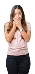 Sticker - Young beautiful brunette woman wearing pink t-shirt over isolated background shocked covering mouth with hands for mistake. Secret concept.