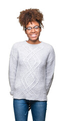 Wall Mural - Beautiful young african american woman wearing winter sweater over isolated background with a happy and cool smile on face. Lucky person.