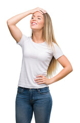 Wall Mural - Beautiful young woman wearing t-shirt and jeans stressed with hand on head, shocked with shame and surprise face, angry and frustrated. Fear and upset for mistake.