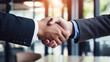 © Andrii Yablonskyi - business handshake photo blurred office in the background created with Generative Ai
