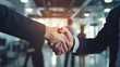 © Andrii Yablonskyi - business handshake photo blurred office in the background created with Generative Ai