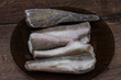 Frozen hake fish carcass on a plate
