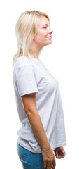 Sticker - Young beautiful blonde woman wearing white t-shirt over isolated background looking to side, relax profile pose with natural face with confident smile.