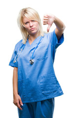 Poster - Young beautiful blonde doctor woman wearing medical uniform over isolated background looking unhappy and angry showing rejection and negative with thumbs down gesture. Bad expression.