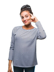 Sticker - Young braided hair african american girl wearing sweater over isolated background smiling and confident gesturing with hand doing size sign with fingers while looking and the camera. Measure concept.