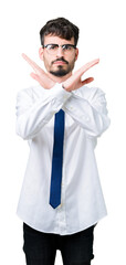 Wall Mural - Young handsome business man wearing glasses over isolated background Rejection expression crossing arms doing negative sign, angry face