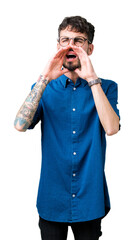 Poster - Young handsome man wearing glasses over isolated background Shouting angry out loud with hands over mouth