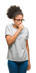 Sticker - Young afro american woman wearing glasses over isolated background feeling unwell and coughing as symptom for cold or bronchitis. Healthcare concept.