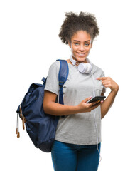Wall Mural - Young beautiful afro american student woman holding backpack over isolated background with surprise face pointing finger to himself
