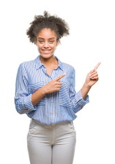 Sticker - Young afro american woman over isolated background smiling and looking at the camera pointing with two hands and fingers to the side.