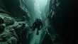 Technical diver navigating through a narrow underwater canyon.