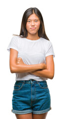 Sticker - Young asian woman over isolated background thinking looking tired and bored with depression problems with crossed arms.