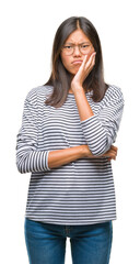 Sticker - Young asian woman wearing glasses over isolated background thinking looking tired and bored with depression problems with crossed arms.