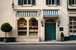 old european village facade , charming boutique storefront ,beige freestone 