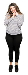 Poster - Young beautiful woman wearing stripes sweater Smiling with open mouth, fingers pointing and forcing cheerful smile