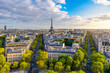 Aerial view of Paris with Eiffel Tower and Champs Elysees from the roof of the Triumphal Arch. Panoramic sunset view of old town of Paris. Popular travel destination