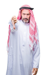 Poster - Senior arab man wearing keffiyeh over isolated background looking unhappy and angry showing rejection and negative with thumbs down gesture. Bad expression.