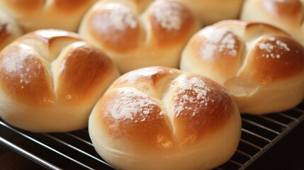 Sticker - A bunch of bread buns sitting on a cooling rack