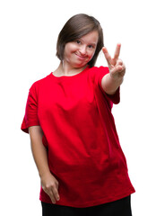 Poster - Young adult woman with down syndrome over isolated background smiling with happy face winking at the camera doing victory sign. Number two.