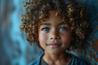 Portrait of a little boy with freckles on his face. Happy boy with freckles on face. Closeup portrait of redhaired little kid with freckles on dark background