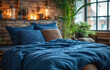 Bed with blue pillow and coverlet near fireplace. Loft interior design of modern bedroom with brick wall.