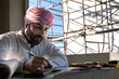 © Jack Tamrong - Arabic architect working with housing project plan in construction site