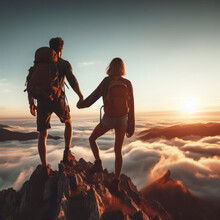 Couple Of Man And Woman Hikers Hand In Hand On Top Of A Mountain At Sunset. Ai Generative