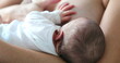 Mom breastfeeding infant newborn baby