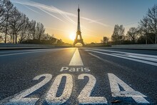 Sunrise Behind The Eiffel Tower With "Paris 2024" Road Marking