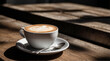Elegant cappuccino composition on rustic table.  Perfect for coffee lovers. High-contrast 50mm lens shot accentuates rich textures and serene ambiance.