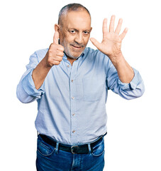 Sticker - Senior man with grey hair and beard wearing casual blue shirt showing and pointing up with fingers number six while smiling confident and happy.