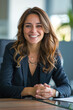 © thejokercze - Smiling woman at table in office. Lawyer, businesswoman, accountant or manager