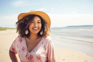 Wall Mural - woman in a hat on the beach