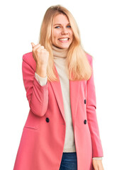 Wall Mural - Young beautiful blonde woman wearing elegant clothes angry and mad raising fist frustrated and furious while shouting with anger. rage and aggressive concept.