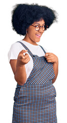 Sticker - Young african american girl wearing casual clothes pointing fingers to camera with happy and funny face. good energy and vibes.