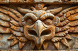 Eagle head stone carving, Aztec inspired wall carving of ancient design, surface material texture