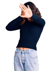 Wall Mural - Young beautiful mixed race woman wearing casual clothes covering eyes with hands and doing stop gesture with sad and fear expression. embarrassed and negative concept.