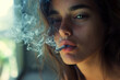 © J S - Closeup of young beautiful woman smoking a cigarette with copy space on smoke