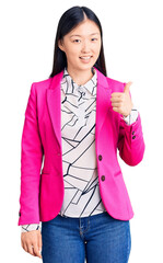 Poster - Young beautiful chinese woman wearing elegant clothes smiling happy and positive, thumb up doing excellent and approval sign