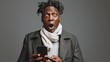 © id512 - amazed shocked African American man holding smartphone in his hand, looking at the phone
