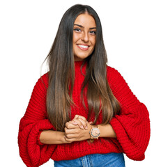 Canvas Print - Beautiful hispanic woman wearing casual clothes with hands together and crossed fingers smiling relaxed and cheerful. success and optimistic