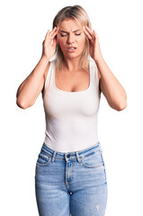 Wall Mural - Young beautiful blonde woman wearing casual sleeveless t-shirt with hand on head for pain in head because stress. suffering migraine.
