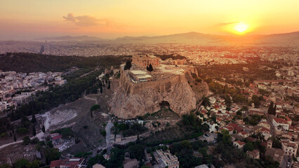 Wall Mural - Aerial drone photo of iconic Acropolis hill and the unique masterpiece of Ancient world the Parthenon at sunset with beautiful golden colours, Athens historic centre, Attica, Greece