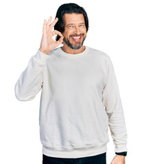 Sticker - Middle age caucasian man wearing casual clothes smiling positive doing ok sign with hand and fingers. successful expression.