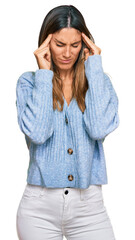 Wall Mural - Young woman wearing casual clothes with hand on head, headache because stress. suffering migraine.