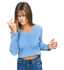 Wall Mural - Teenager caucasian girl wearing casual clothes angry and mad raising fist frustrated and furious while shouting with anger. rage and aggressive concept.