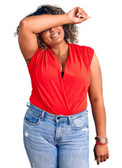 Wall Mural - Young african american plus size woman wearing casual style with sleeveless shirt covering eyes with arm smiling cheerful and funny. blind concept.