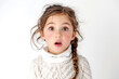 Expressive facial expression. Shocked stupefaction A beautiful little girl in fashionable clothes stands on a white background, with her jaw hanging open, feeling stunned by what she sees around her